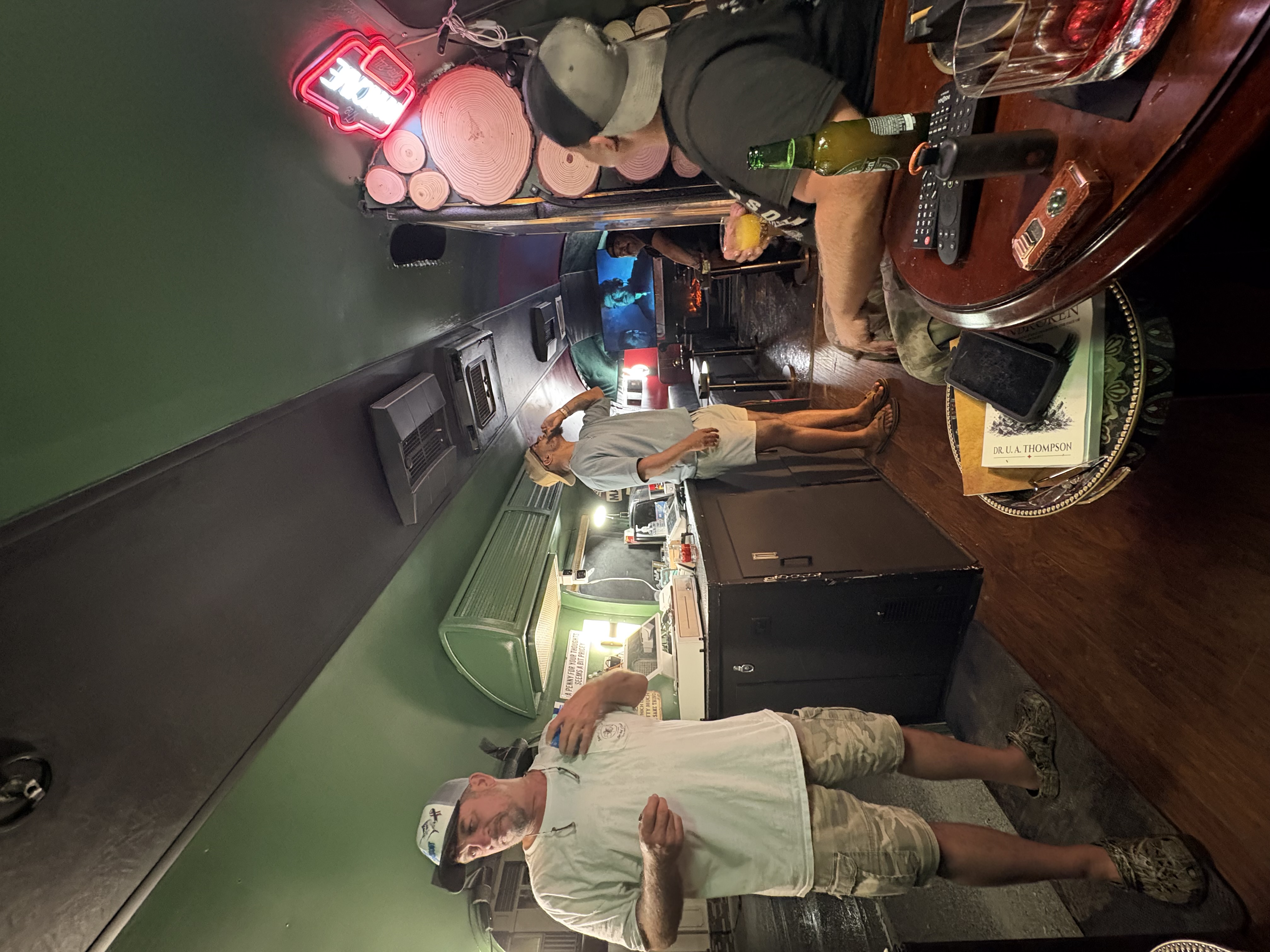 Guests relaxing at the bar inside the Airstream lounge